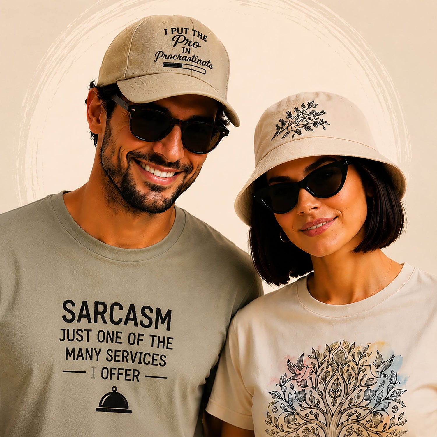 Couple wearing casual hats with embroidered graphic designs, smiling and posing against a beige studio background with a subtle circular brushstroke accent.